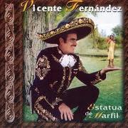 El texto musical DIME A QUE SANTO LE REZAS de VICENTE FERNANDEZ también está presente en el álbum Estatua de marfil (1997)