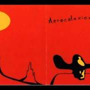 El texto musical AT THE TABLE HE SAT ALONE WITH A GLASS AND BOTTLE OF WINE de CALEXICO también está presente en el álbum Aerocalexico (2001)