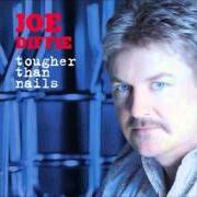 El texto musical THIS TIME LAST YEAR de JOE DIFFIE también está presente en el álbum Tougher than nails (2004)