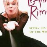 El texto musical PURPLE RAIN de LEANN RIMES también está presente en el álbum Sittin' on the top of the world (1998)