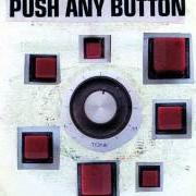 El texto musical PUSH ANY BUTTON de SAM PHILLIPS también está presente en el álbum Push any button (2013)