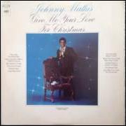 El texto musical WHAT ARE YOU DOING NEW YEAR'S EVE? de JOHNNY MATHIS también está presente en el álbum Give me your love for christmas